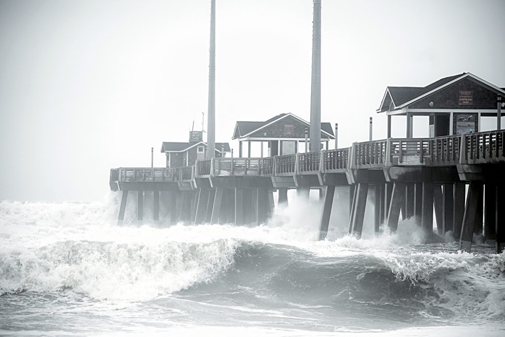Waves top the railing at Jennette's Pier on Sunday 11/17.
