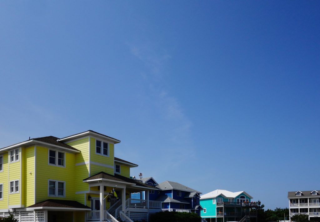 Colorful beach houses in Nags Head on the North Carolina Outer Banks, showing different sized homes on the Outer Banks, NC