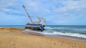 A boat on the Outer Banks being shipwrecked on a sandbar