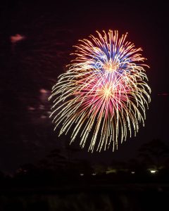 A closeup shot of fireworks being fired over the Outer Banks