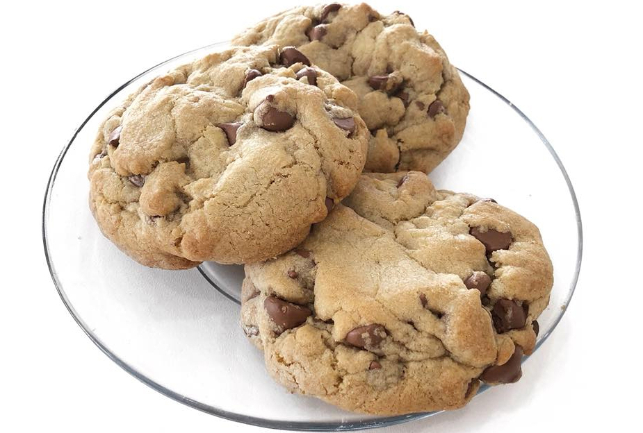 A plate of Crumbl chocolate chip cookies.