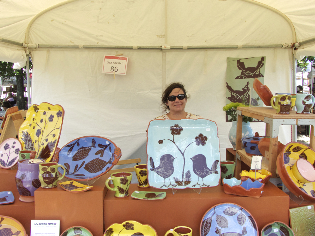 Lisa Kovac with her pottery on display at New World Festival of the Arts.