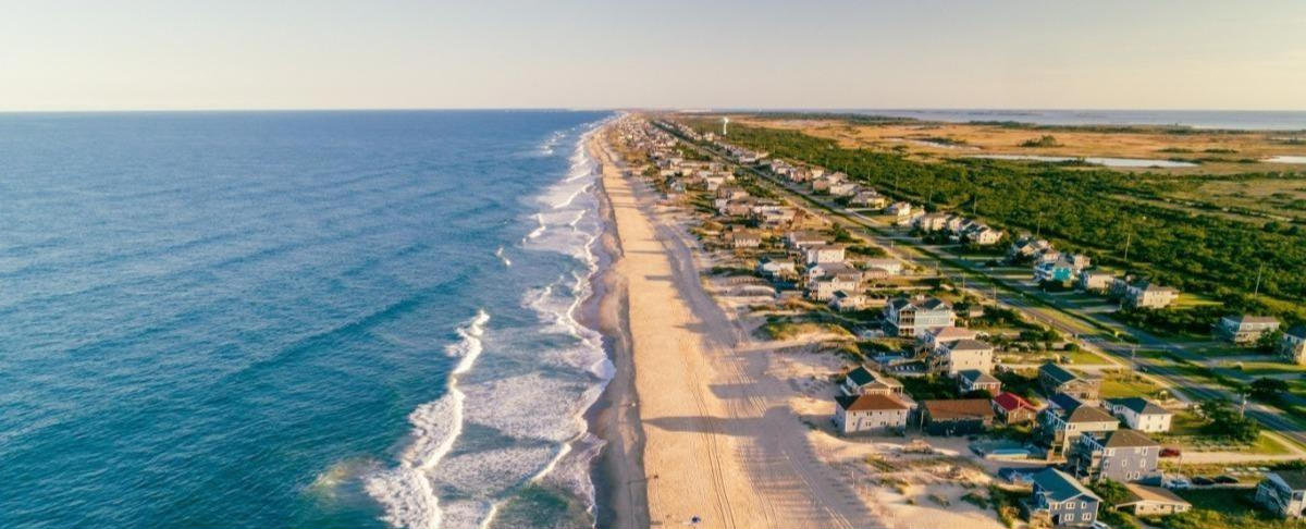 Overhead look of the Outer Banks coastline with beachfront houses.