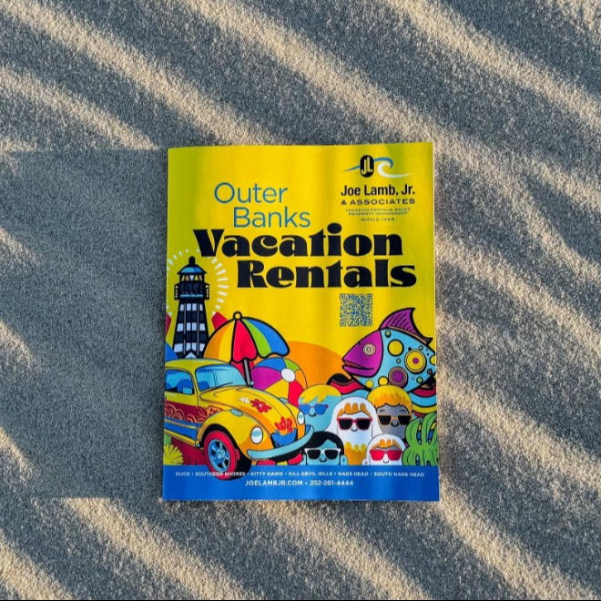 a brochure laying in the sand