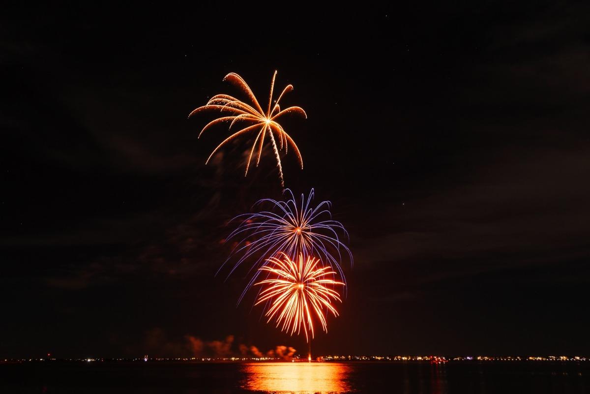 firework display over the water at night